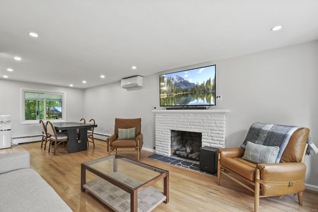 63 Paul Ter, Southington, CT 06489 - living area with a wall mounted AC, baseboard heating, light wood finished floors, and recessed lighting
