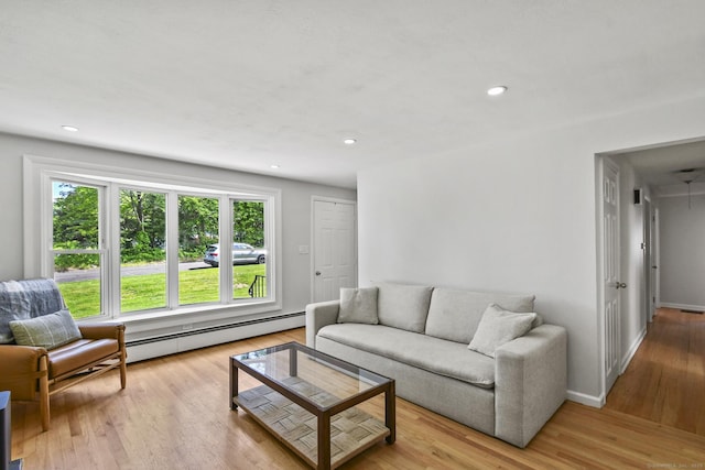 63 Paul Ter, Southington, CT 06489 - living area featuring baseboard heating, light wood-style flooring, recessed lighting, and baseboards