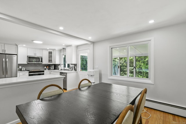 63 Paul Ter, Southington, CT 06489 - dining space featuring a baseboard heating unit, recessed lighting, and light wood-style flooring