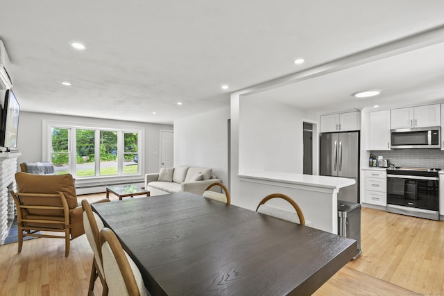 63 Paul Ter, Southington, CT 06489 - dining area featuring recessed lighting, a baseboard heating unit, and light wood-type flooring