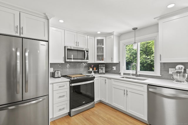 63 Paul Ter, Southington, CT 06489 - kitchen featuring appliances with stainless steel finishes, a sink, light countertops, white cabinetry, and recessed lighting