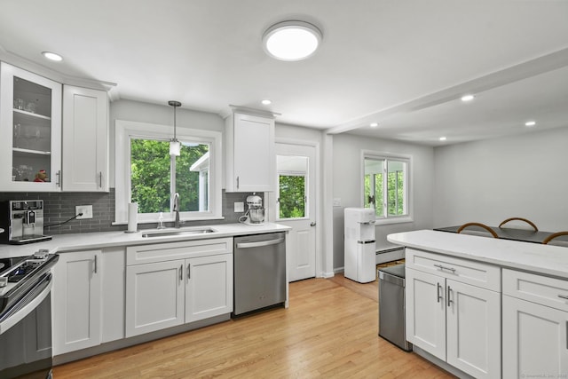 63 Paul Ter, Southington, CT 06489 - kitchen with stainless steel appliances, a sink, backsplash, plenty of natural light, and recessed lighting