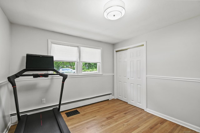 63 Paul Ter, Southington, CT 06489 - exercise area with a baseboard radiator, light wood-style flooring, and baseboards