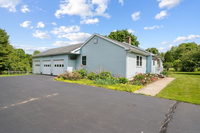7 Wawecus Hill Rd, Bozrah, CT 06334 - view of home's exterior with a chimney and a lawn