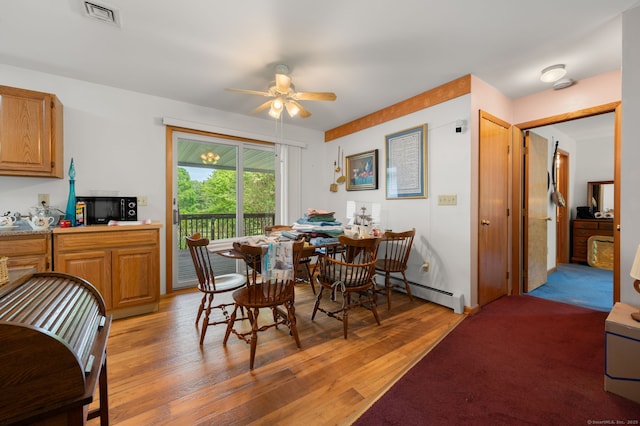 7 Wawecus Hill Rd, Bozrah, CT 06334 - dining area with baseboard heating, a ceiling fan, and light wood finished floors