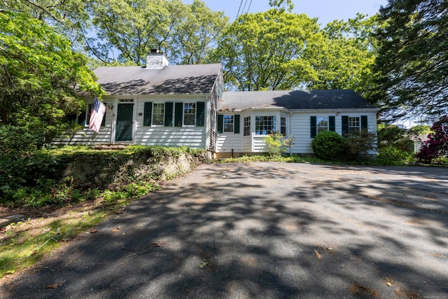 121 Warren Ave, Groton, CT 06355 - view of front of house featuring a chimney and roof with shingles