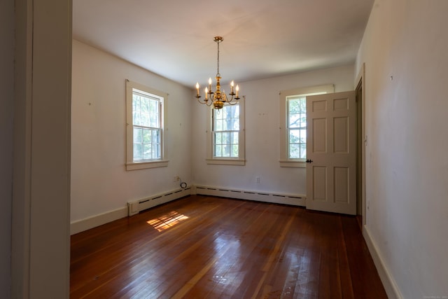 121 Warren Ave, Groton, CT 06355 - spare room featuring dark wood finished floors, a chandelier, and baseboards