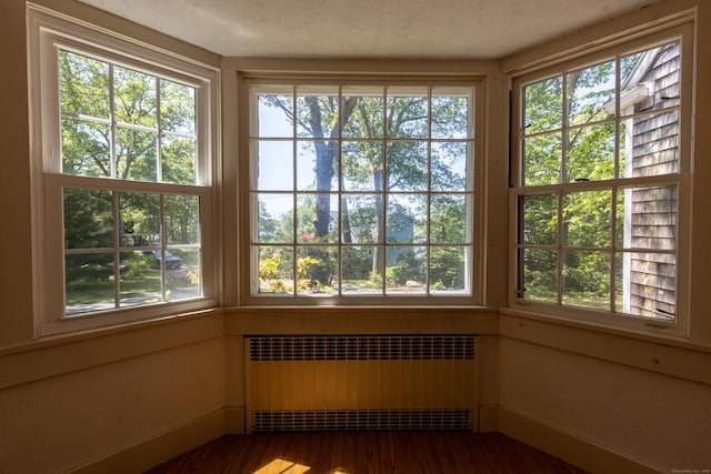 121 Warren Ave, Groton, CT 06355 - unfurnished sunroom featuring radiator heating unit