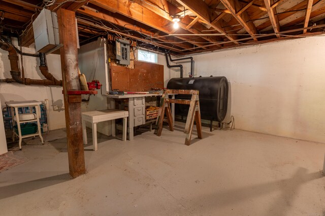 121 Warren Ave, Groton, CT 06355 - basement featuring heating fuel, a workshop area, and electric panel