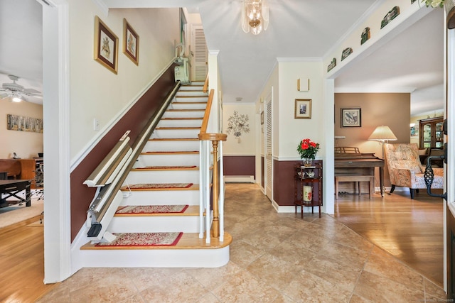 26 Dale Rd, Trumbull, CT 06611 - stairs with crown molding, ceiling fan, wainscoting, and baseboard heating