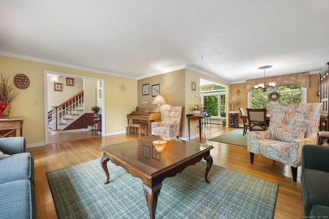 26 Dale Rd, Trumbull, CT 06611 - living room featuring light wood-style floors, stairway, healthy amount of natural light, ornamental molding, and baseboards