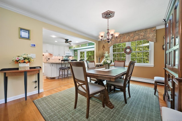 26 Dale Rd, Trumbull, CT 06611 - dining area with crown molding, a chandelier, light wood-type flooring, baseboards, and ceiling fan