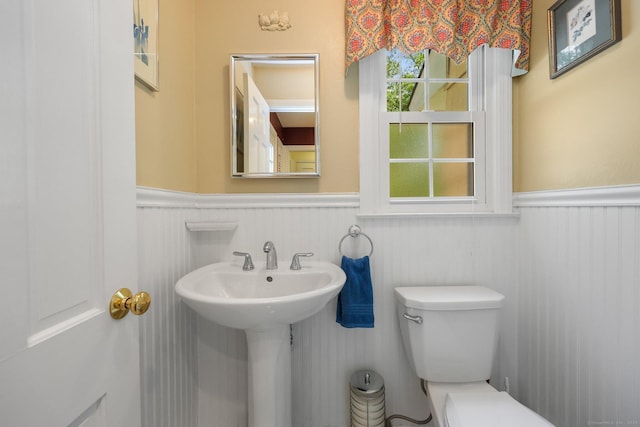 26 Dale Rd, Trumbull, CT 06611 - half bathroom featuring a wainscoted wall, toilet, and a sink