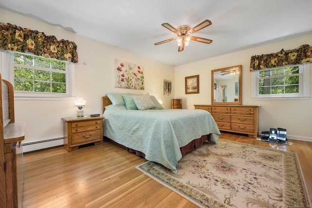 26 Dale Rd, Trumbull, CT 06611 - bedroom with baseboard heating, multiple windows, wood finished floors, and a ceiling fan
