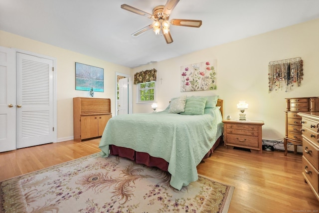 26 Dale Rd, Trumbull, CT 06611 - bedroom with light wood-type flooring, a baseboard heating unit, and a ceiling fan