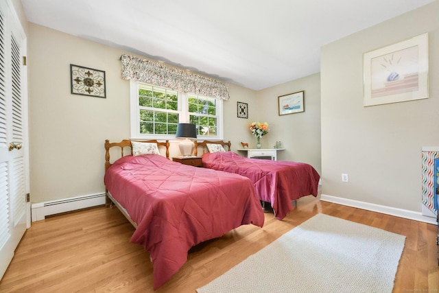 26 Dale Rd, Trumbull, CT 06611 - bedroom with a baseboard radiator, light wood-style flooring, and baseboards