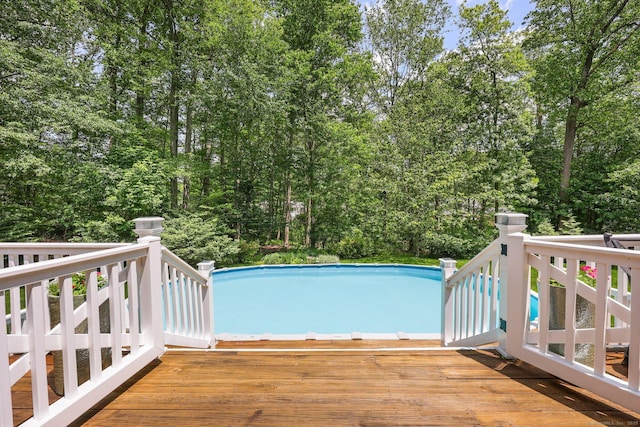 26 Dale Rd, Trumbull, CT 06611 - swimming pool featuring a wooden deck and view of wooded area