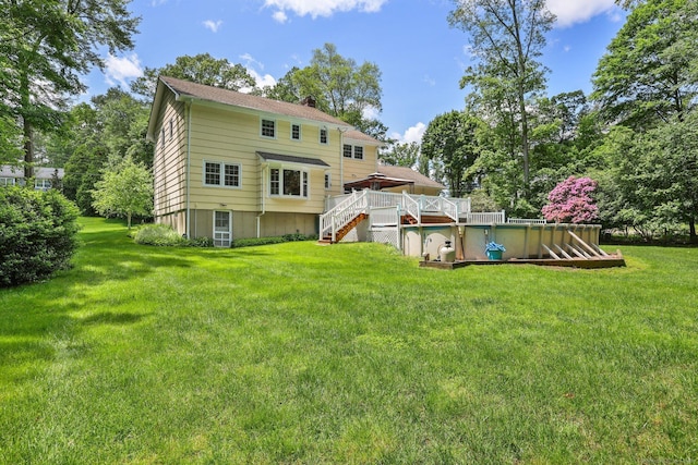 26 Dale Rd, Trumbull, CT 06611 - back of house featuring stairway, a deck, a lawn, and a chimney