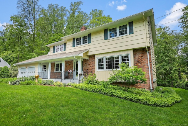 26 Dale Rd, Trumbull, CT 06611 - view of front of home featuring a chimney, brick siding, a garage, a front lawn, and a porch
