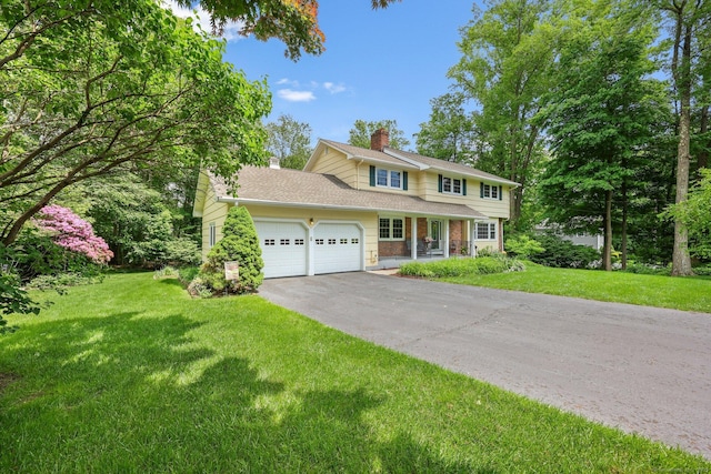 26 Dale Rd, Trumbull, CT 06611 - traditional home featuring an attached garage, a chimney, driveway, a front yard, and covered porch