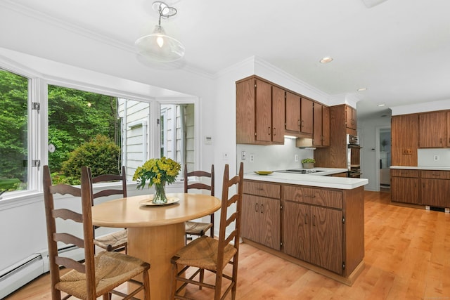 1111 Merwins Ln, Fairfield, CT 06824 - kitchen featuring black electric cooktop, light countertops, a peninsula, brown cabinets, and light wood-type flooring