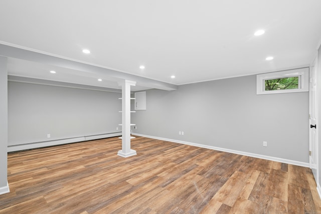 1111 Merwins Ln, Fairfield, CT 06824 - below grade area with a baseboard radiator, recessed lighting, baseboards, and wood finished floors