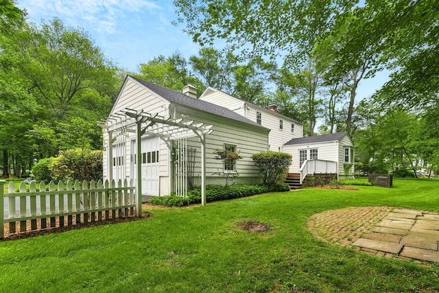 1111 Merwins Ln, Fairfield, CT 06824 - view of green lawn featuring a garage, a wooden deck, and central AC