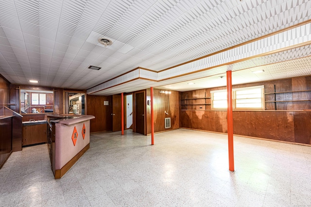 77 Hesse Rd, Hamden, CT 06517 - kitchen featuring wooden walls, light floors, and open floor plan