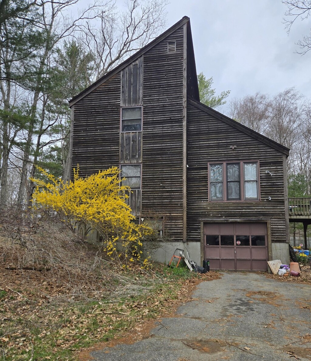 47 Elizabeth Rd, Mansfield, CT 06250 - view of property exterior featuring driveway and an attached garage