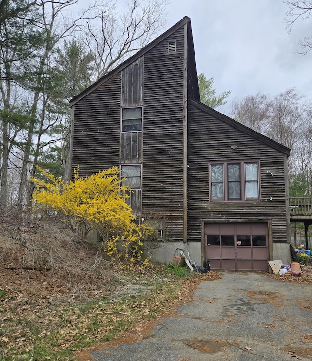 47 Elizabeth Rd, Mansfield, CT 06250 - view of property exterior featuring driveway and an attached garage