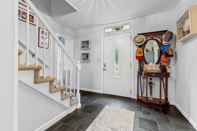 39 Munn Rd, Southbury, CT 06488 - entrance foyer with baseboards, stone tile flooring, and stairway