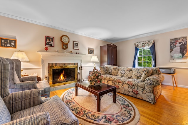39 Munn Rd, Southbury, CT 06488 - living area with light wood-type flooring, ornamental molding, and a glass covered fireplace