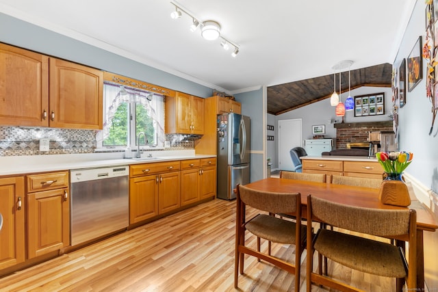 39 Munn Rd, Southbury, CT 06488 - kitchen with appliances with stainless steel finishes, a sink, a fireplace, light wood finished floors, and backsplash