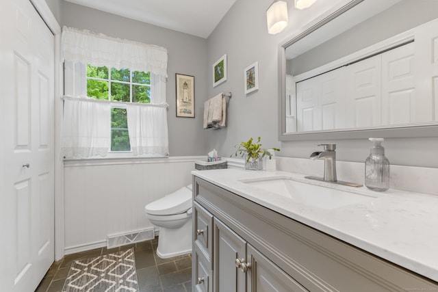 39 Munn Rd, Southbury, CT 06488 - bathroom featuring vanity, toilet, and wainscoting