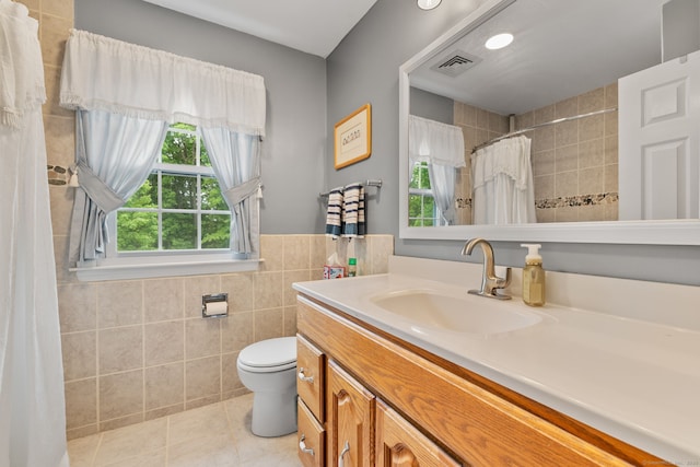 39 Munn Rd, Southbury, CT 06488 - full bath with tile walls, tile patterned floors, vanity, toilet, and a tile shower