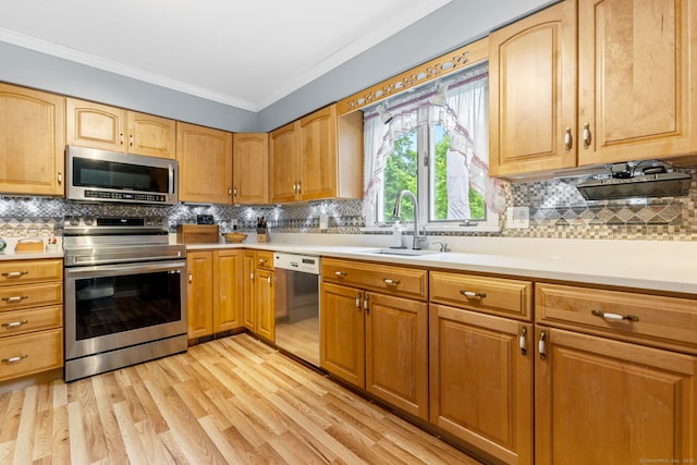 39 Munn Rd, Southbury, CT 06488 - kitchen with appliances with stainless steel finishes, crown molding, light wood finished floors, a sink, and backsplash