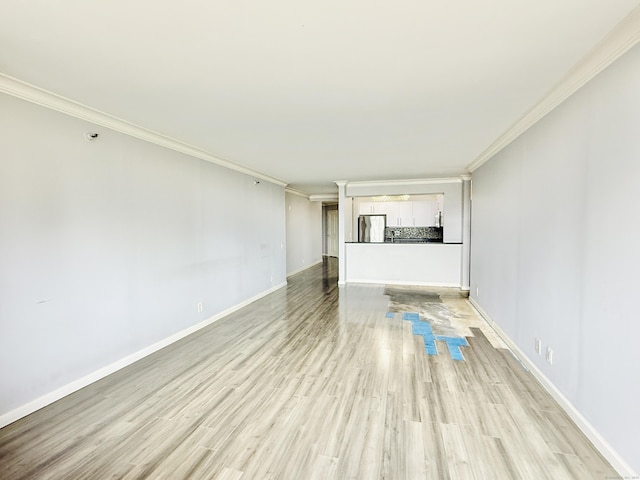 25 Forest St Unit 11A, Stamford, CT 06901 - unfurnished living room featuring ornamental molding, light wood-type flooring, and baseboards