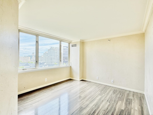 25 Forest St Unit 11A, Stamford, CT 06901 - empty room with wood finished floors, crown molding, baseboards, and a city view