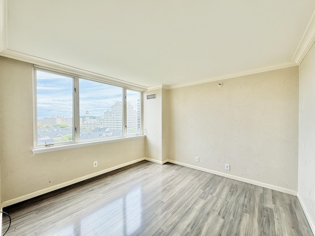 25 Forest St Unit 11A, Stamford, CT 06901 - unfurnished room featuring wood finished floors, baseboards, ornamental molding, and a city view