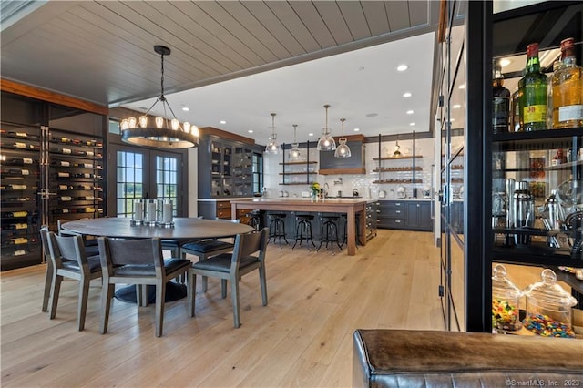 66 High St Unit 17, Guilford, CT 06437 - dining room featuring a chandelier, light wood finished floors, recessed lighting, and wood ceiling