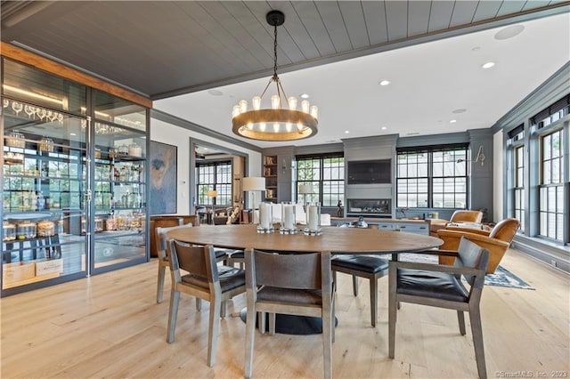 66 High St Unit 17, Guilford, CT 06437 - dining area featuring light wood-type flooring and a chandelier