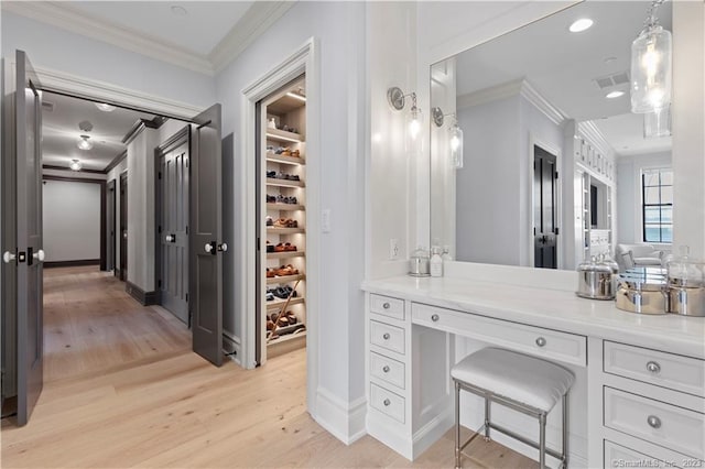 66 High St Unit 17, Guilford, CT 06437 - bathroom featuring crown molding, wood finished floors, and recessed lighting