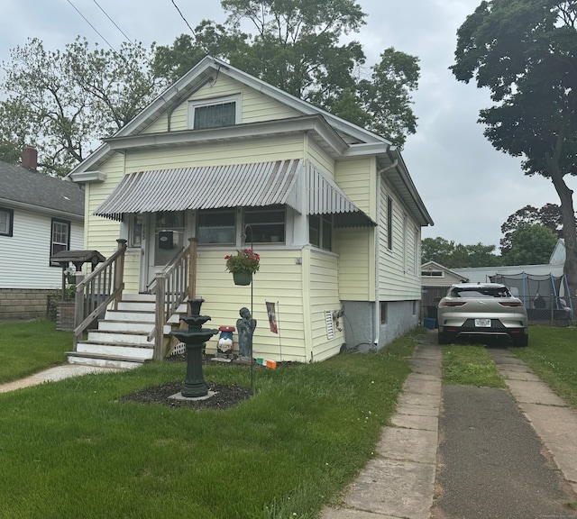 165 Dodge Ave, East Haven, CT 06512 - view of front of home with driveway and a front yard
