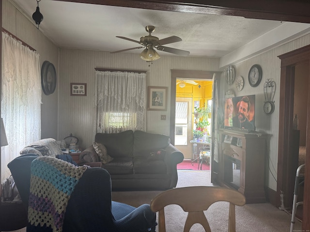 165 Dodge Ave, East Haven, CT 06512 - carpeted living room with a ceiling fan and a fireplace