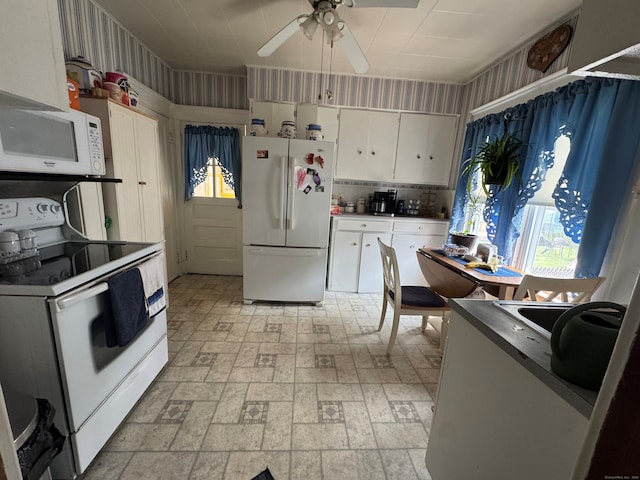 165 Dodge Ave, East Haven, CT 06512 - kitchen featuring white appliances, white cabinets, ceiling fan, brick patterned floors, and healthy amount of natural light