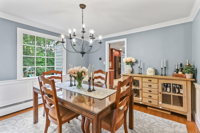 17 Stockade Rd, Simsbury, CT 06092 - dining area featuring a chandelier, crown molding, and wood finished floors