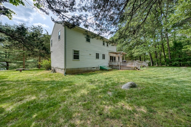 24 Marbella Ln, Tolland, CT 06084 - rear view of house with a deck and a yard