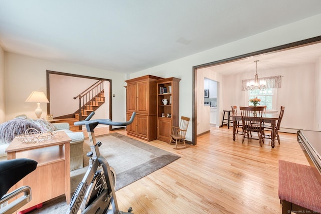 24 Marbella Ln, Tolland, CT 06084 - living area with light wood-style flooring, a chandelier, stairs, and a baseboard radiator