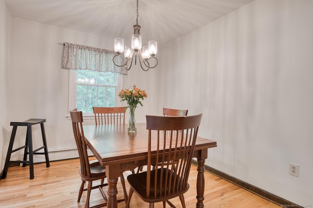 24 Marbella Ln, Tolland, CT 06084 - dining space with a chandelier, light wood-style flooring, and baseboards