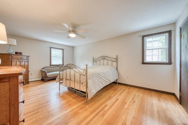 24 Marbella Ln, Tolland, CT 06084 - bedroom featuring multiple windows, light wood-style flooring, and baseboards